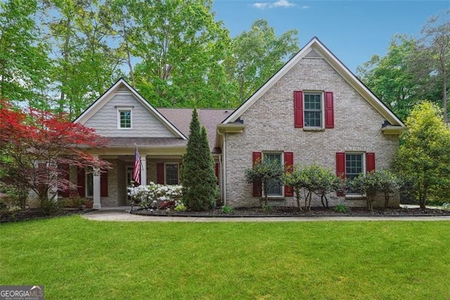 7045 Mountain Xing, Cumming, GA 30041 - craftsman-style house with brick siding and a front yard