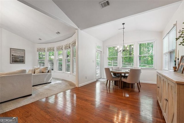 7045 Mountain Xing, Cumming, GA 30041 - dining room featuring vaulted ceiling, hardwood / wood-style floors, and visible vents