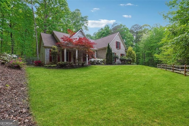 7045 Mountain Xing, Cumming, GA 30041 - exterior space featuring a lawn and fence