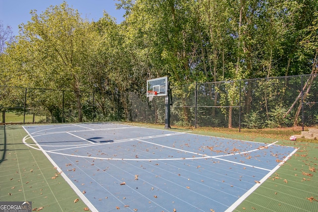 7045 Mountain Xing, Cumming, GA 30041 - view of basketball court featuring basketball court and fence