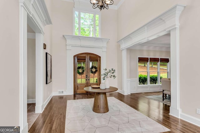 1400 Squire Ln, Cumming, GA 30041 - foyer featuring visible vents, wood finished floors, a wealth of natural light, and a chandelier