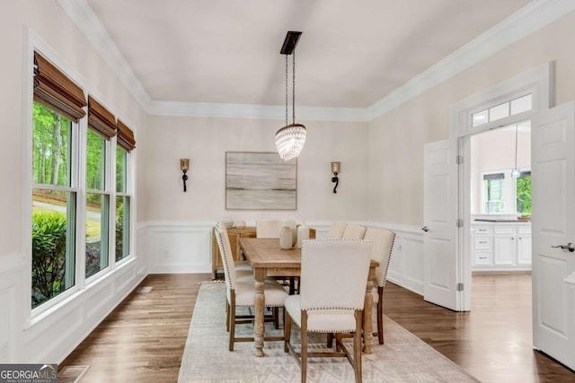 1400 Squire Ln, Cumming, GA 30041 - dining space featuring wood finished floors, visible vents, ornamental molding, and wainscoting