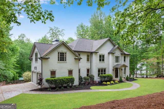 1400 Squire Ln, Cumming, GA 30041 - french country inspired facade with a front lawn, driveway, a chimney, an attached garage, and stucco siding
