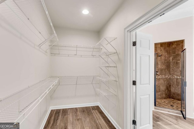 1400 Squire Ln, Cumming, GA 30041 - spacious closet featuring wood finished floors