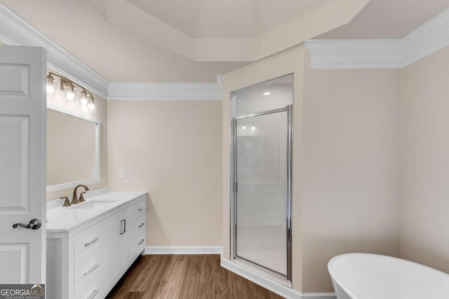 1400 Squire Ln, Cumming, GA 30041 - bathroom with a shower stall, wood finished floors, vanity, a freestanding bath, and baseboards