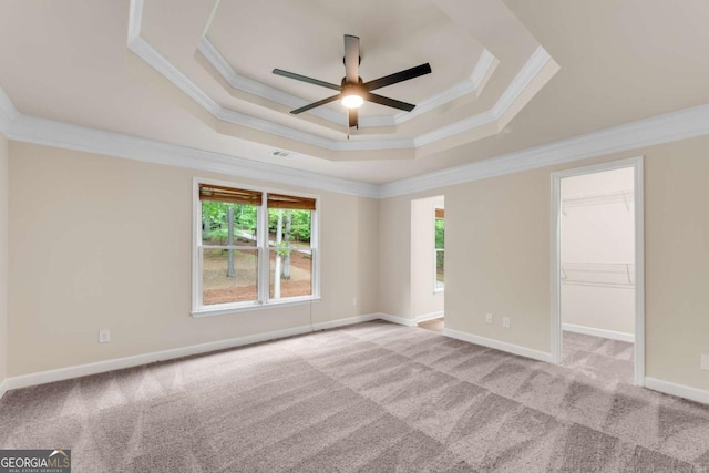 1400 Squire Ln, Cumming, GA 30041 - spare room with a tray ceiling, visible vents, carpet floors, crown molding, and ceiling fan