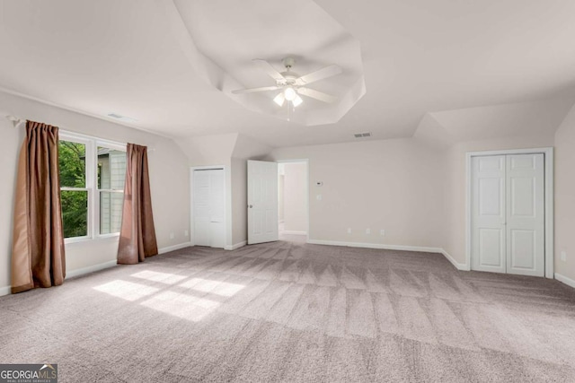 1400 Squire Ln, Cumming, GA 30041 - unfurnished bedroom with visible vents, baseboards, carpet, lofted ceiling, and ceiling fan