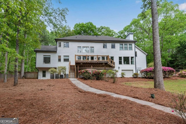 1400 Squire Ln, Cumming, GA 30041 - back of house with stairway, a wooden deck, a chimney, and fence