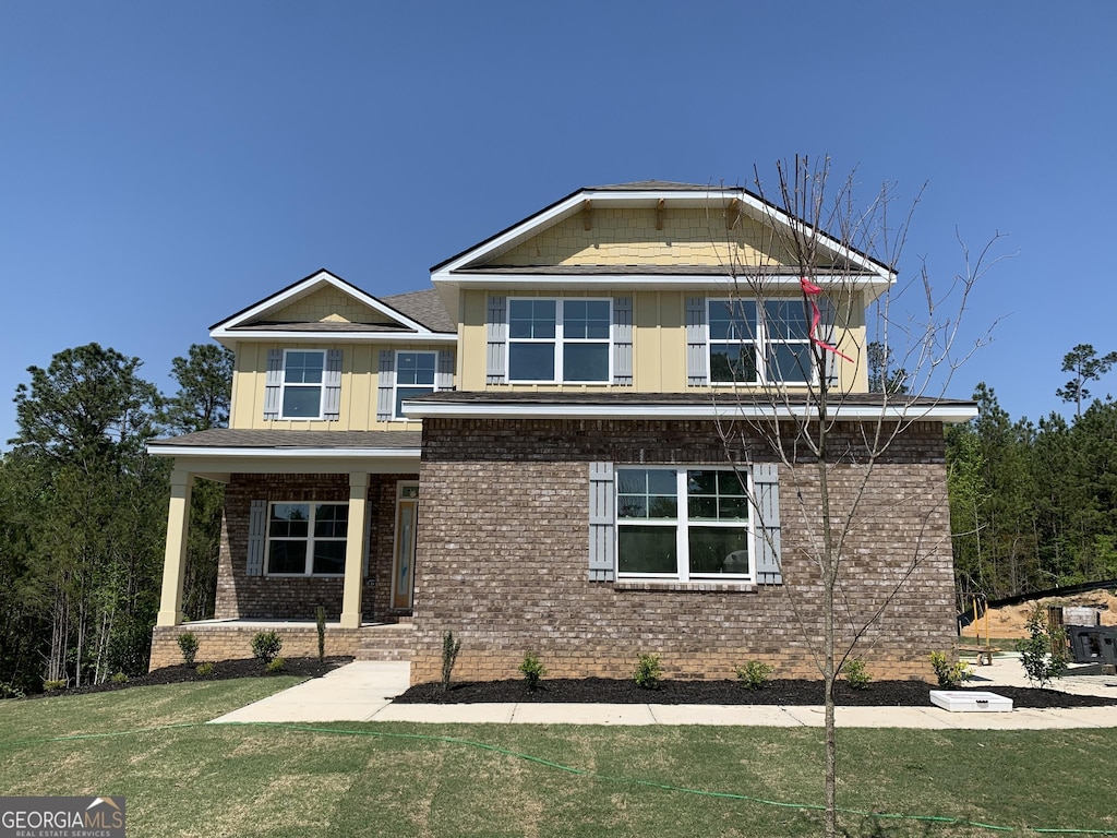 117 Abberley Ln, Macon, GA 31216 - craftsman-style home featuring brick siding, a front yard, and a porch