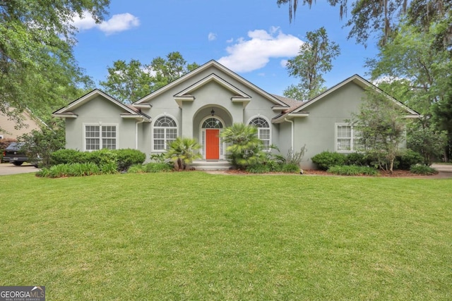 277 Cinder Hill Dr, Brunswick, GA 31523 - single story home featuring a front yard and stucco siding
