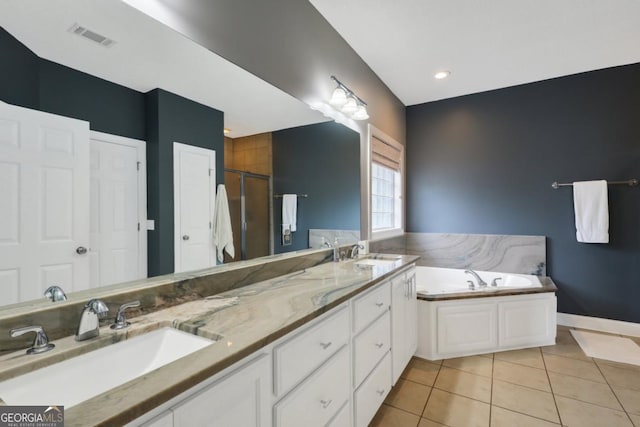 277 Cinder Hill Dr, Brunswick, GA 31523 - bathroom featuring tile patterned floors, visible vents, a sink, and double vanity