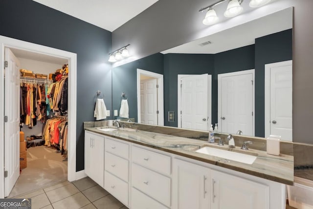 277 Cinder Hill Dr, Brunswick, GA 31523 - full bath with a spacious closet, tile patterned flooring, a sink, and double vanity