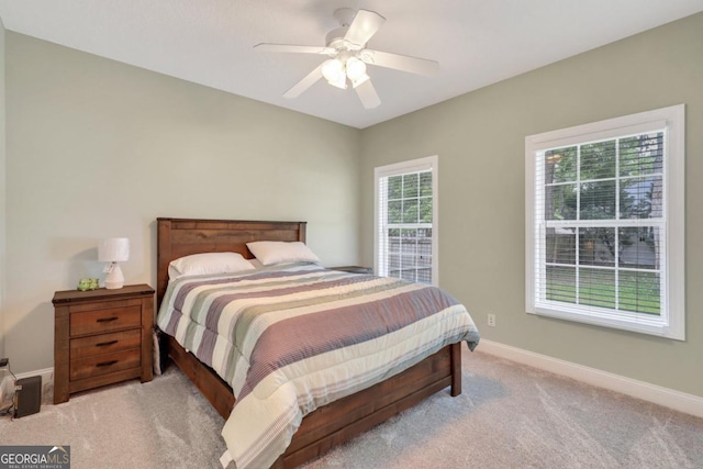 277 Cinder Hill Dr, Brunswick, GA 31523 - bedroom with light carpet, a ceiling fan, and baseboards