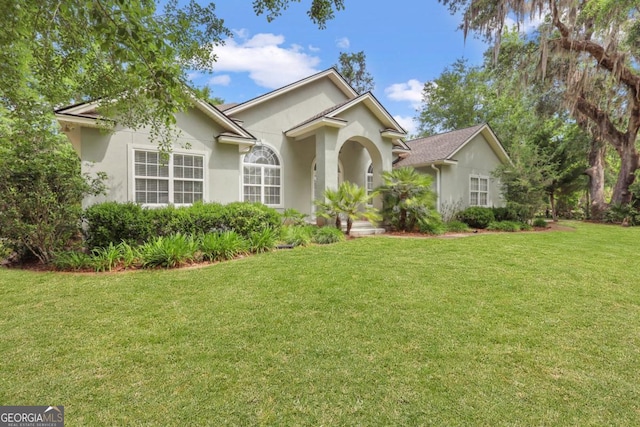 277 Cinder Hill Dr, Brunswick, GA 31523 - single story home featuring stucco siding and a front yard