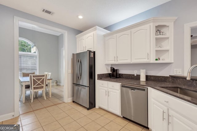277 Cinder Hill Dr, Brunswick, GA 31523 - kitchen with dark stone counters, open shelves, a sink, appliances with stainless steel finishes, and visible vents