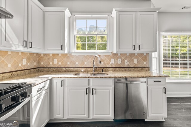 990 Lilac Arbor Rd, Dacula, GA 30019 - kitchen with visible vents, wall chimney exhaust hood, white cabinetry, a sink, and dishwasher