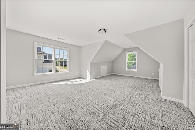 990 Lilac Arbor Rd, Dacula, GA 30019 - bonus room with baseboards, lofted ceiling, and carpet