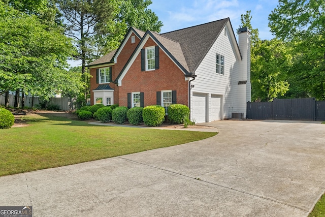 990 Lilac Arbor Rd, Dacula, GA 30019 - view of front of property with driveway, a garage, brick siding, fence, and a front lawn