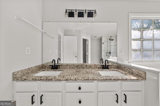 990 Lilac Arbor Rd, Dacula, GA 30019 - bathroom with a shower stall, a sink, and plenty of natural light