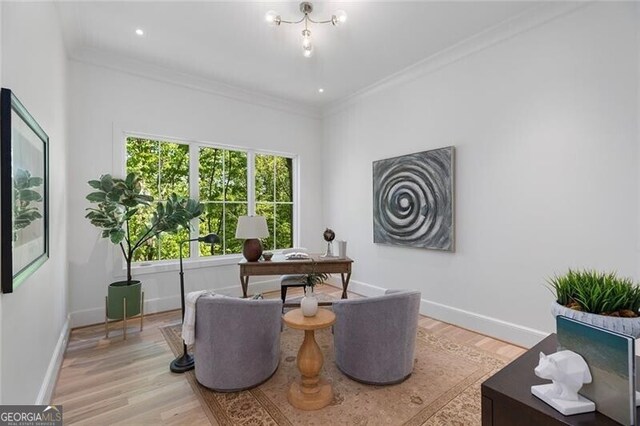 office featuring light wood finished floors, baseboards, and ornamental molding