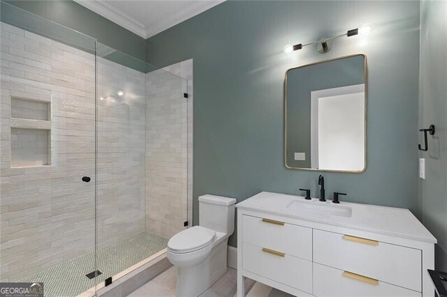 full bathroom with a shower stall, crown molding, vanity, and toilet