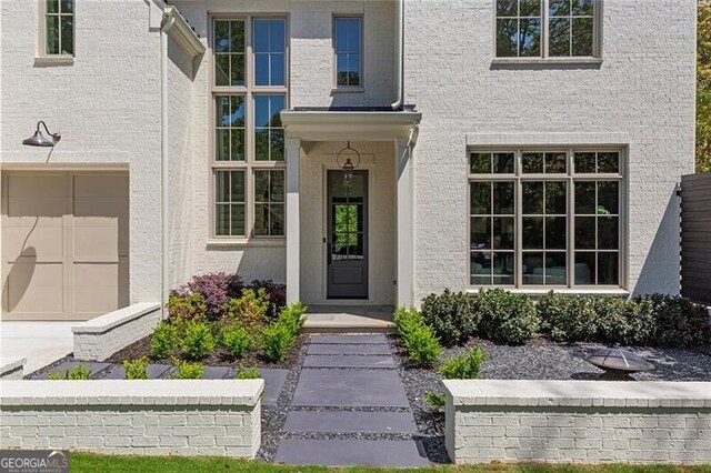 property entrance with an attached garage