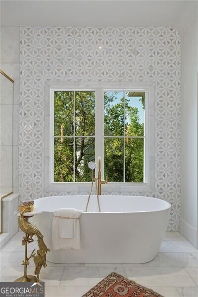 bathroom with a freestanding bath and a shower