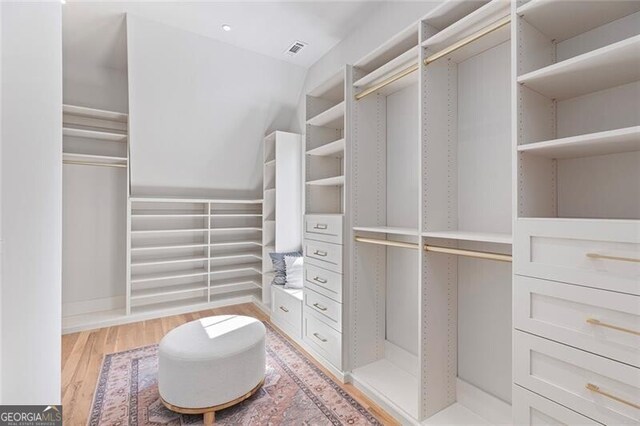 walk in closet featuring light wood-style floors and visible vents