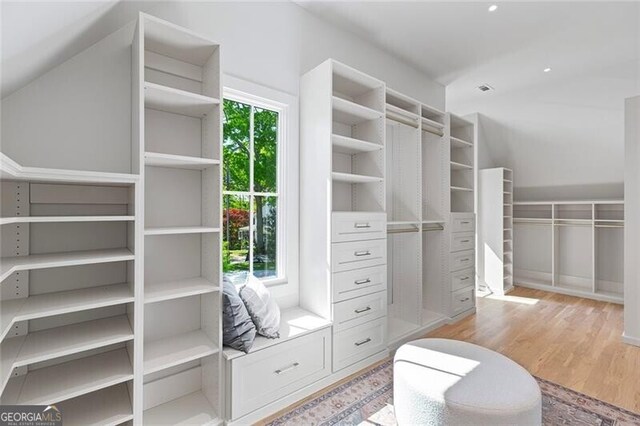 spacious closet with light wood-style floors