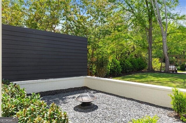 exterior space with an outdoor fire pit
