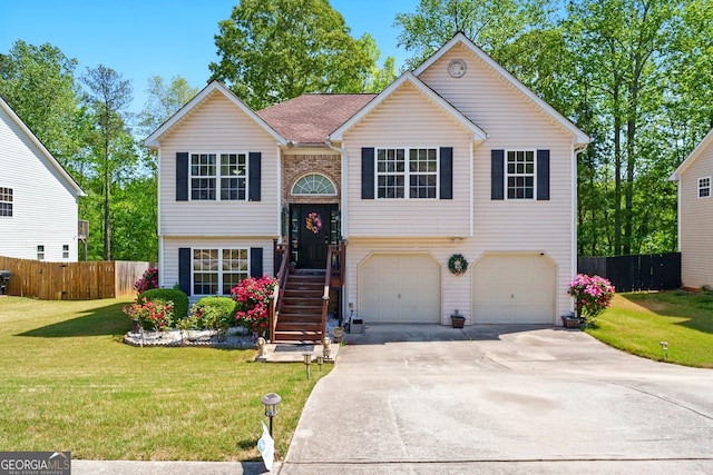 1010 Augusta Woods Dr, Douglasville, GA 30134 - split foyer home with an attached garage, driveway, a front lawn, and fence