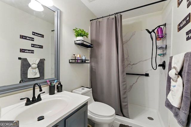 1010 Augusta Woods Dr, Douglasville, GA 30134 - bathroom with toilet, vanity, a textured ceiling, and a stall shower