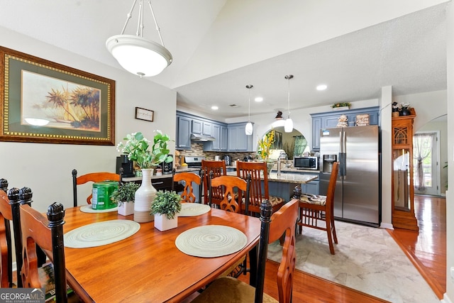 1010 Augusta Woods Dr, Douglasville, GA 30134 - dining area featuring vaulted ceiling, light wood-style floors, and recessed lighting