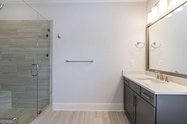 4405 Croftshire Pl, Cumming, GA 30040 - full bathroom with vanity, a shower stall, and baseboards