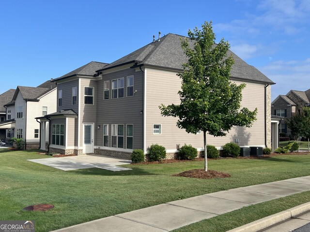4405 Croftshire Pl, Cumming, GA 30040 - back of house with a patio area and a lawn