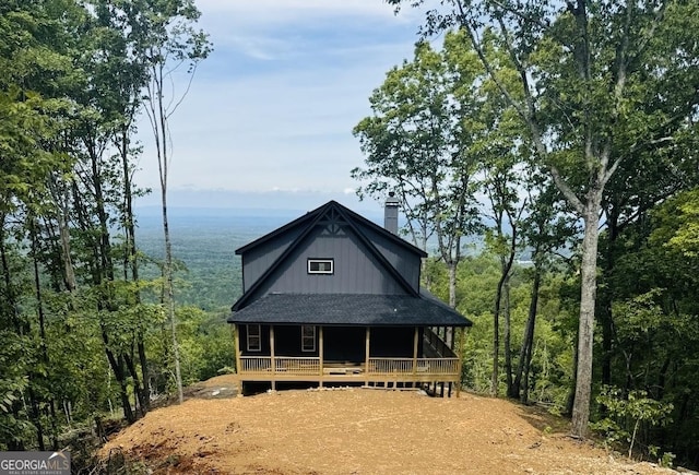 198 Stirratt Rd, Ranger, GA 30734 - view of front facade with covered porch, a chimney, and a shingled roof