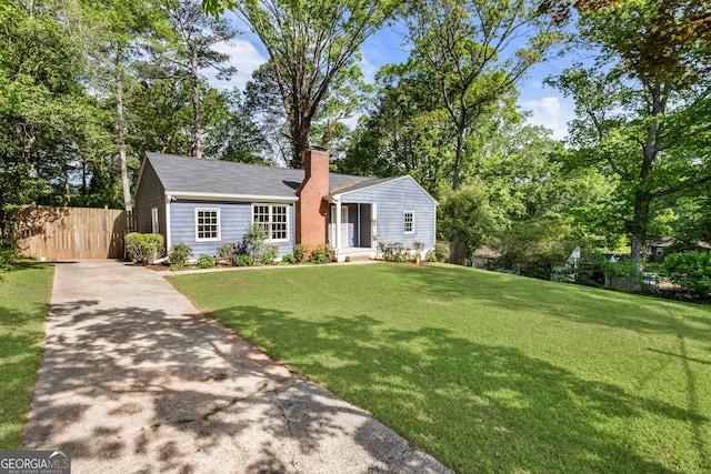 1541 Pontiac Pl SE, Atlanta, GA 30315 - ranch-style home with a chimney, a front lawn, aphalt driveway, and fence