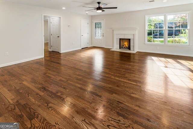 1541 Pontiac Pl SE, Atlanta, GA 30315 - unfurnished living room with a fireplace with flush hearth, baseboards, wood finished floors, and ceiling fan