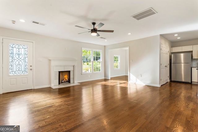 1541 Pontiac Pl SE, Atlanta, GA 30315 - unfurnished living room featuring a tiled fireplace, visible vents, dark wood-style floors, and ceiling fan