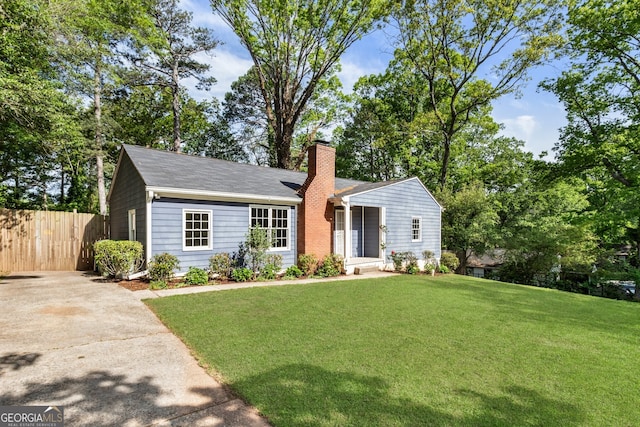 1541 Pontiac Pl SE, Atlanta, GA 30315 - ranch-style home featuring a front yard, concrete driveway, a chimney, and fence