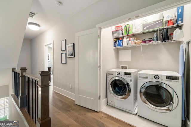 986 Mauldin St SE, Atlanta, GA 30316 - laundry room featuring laundry area, visible vents, washing machine and dryer, wood finished floors, and baseboards