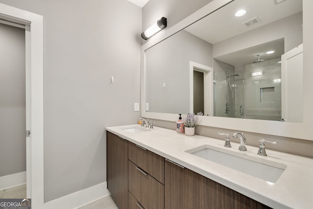 986 Mauldin St SE, Atlanta, GA 30316 - full bathroom with visible vents, a sink, double vanity, and a shower stall