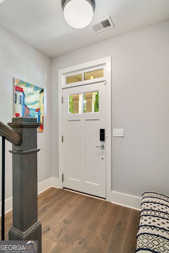 986 Mauldin St SE, Atlanta, GA 30316 - foyer entrance with visible vents, baseboards, and wood finished floors