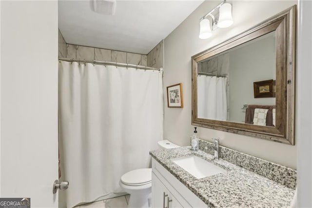 full bathroom featuring vanity, curtained shower, and toilet