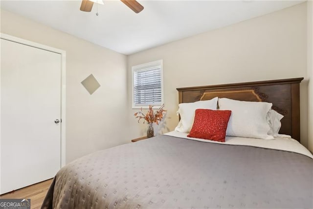 bedroom with ceiling fan and wood finished floors