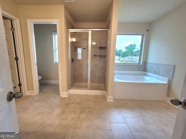bathroom with toilet, a stall shower, visible vents, tile patterned flooring, and a garden tub