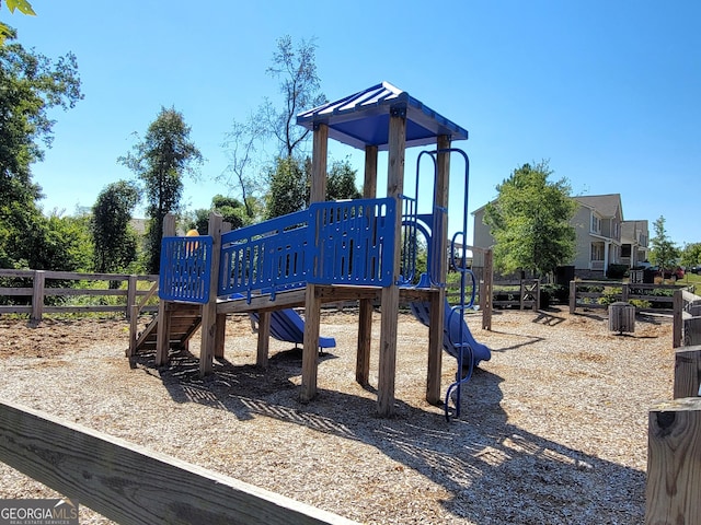 community jungle gym featuring fence