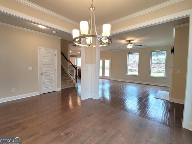 interior space featuring baseboards, ceiling fan with notable chandelier, stairs, dark wood-type flooring, and ornamental molding