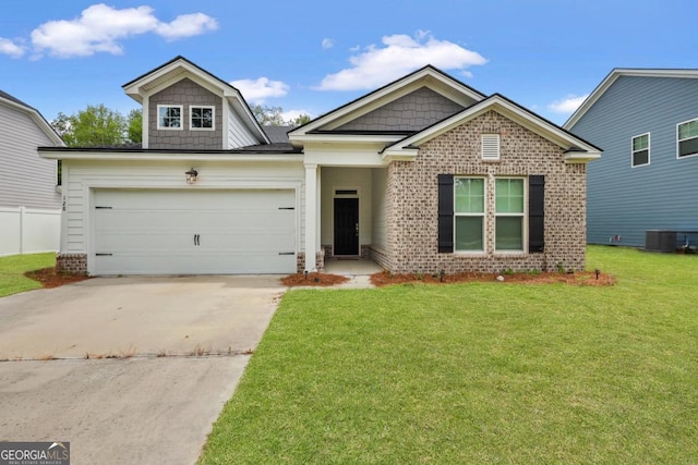 128 Clearwater Dr, Brunswick, GA 31523 - craftsman inspired home with a front lawn, central AC, concrete driveway, brick siding, and a garage