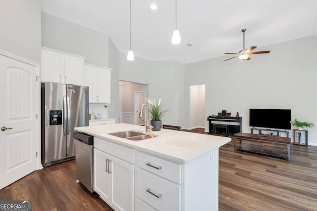 128 Clearwater Dr, Brunswick, GA 31523 - kitchen featuring a towering ceiling, light countertops, a sink, appliances with stainless steel finishes, and ceiling fan
